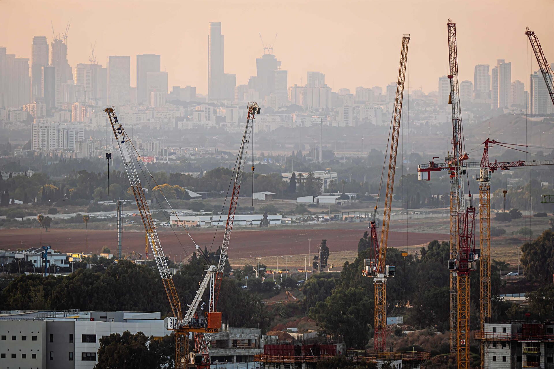 Construction cranes over the city